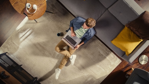 man with laptop at home